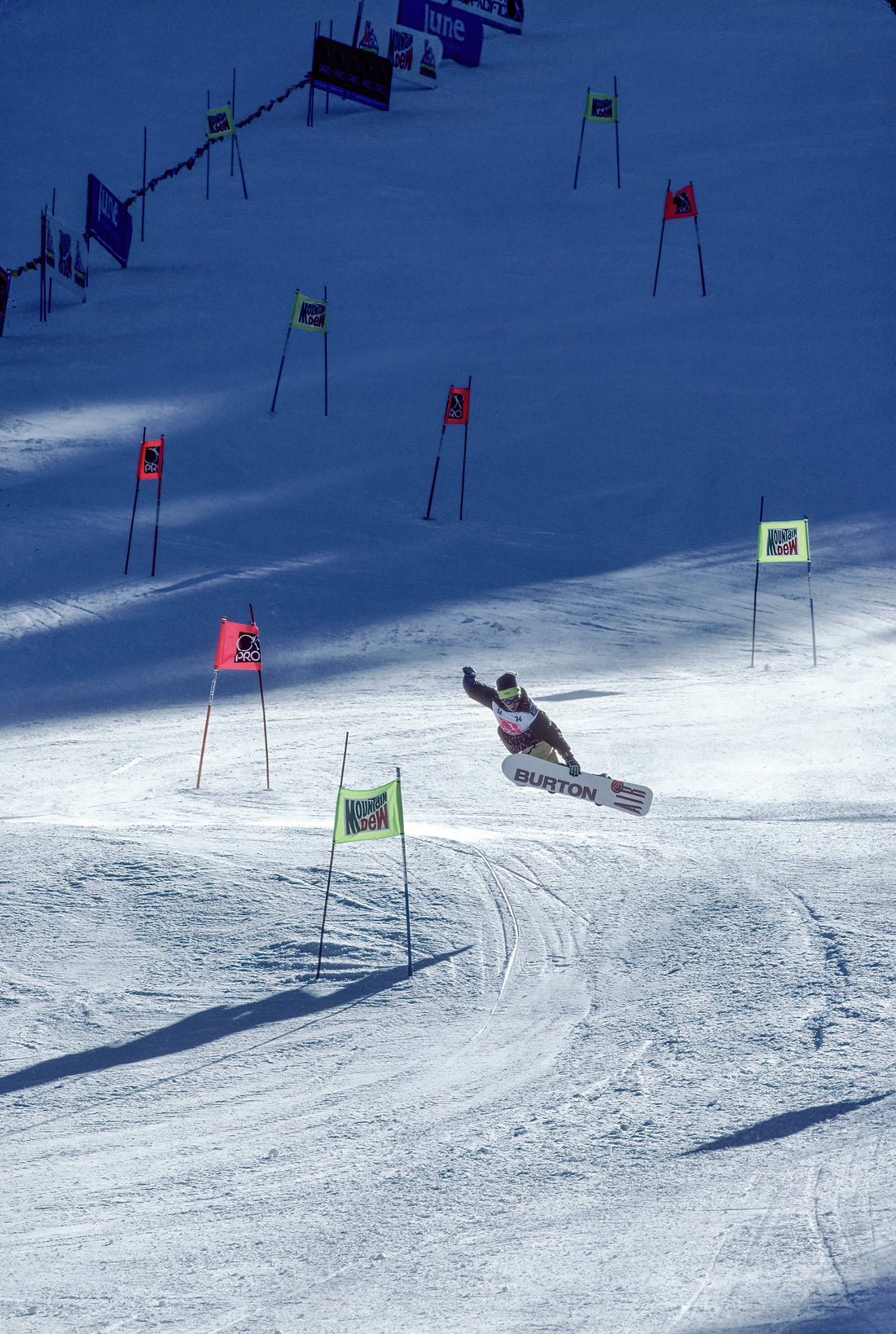 Snowboarder Jeff Brushie method air over the finish line