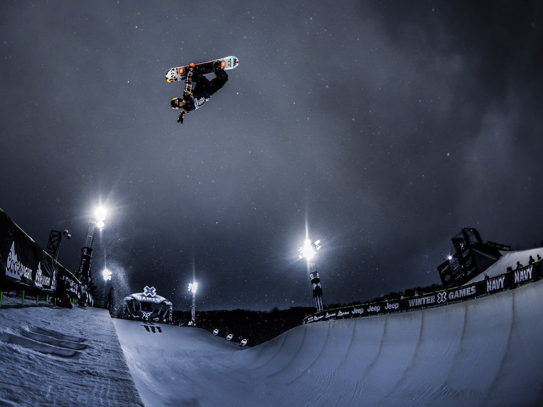 Snowboarder Ben Ferguson jumping out of the halfpipe at Aspen X Games 2016
